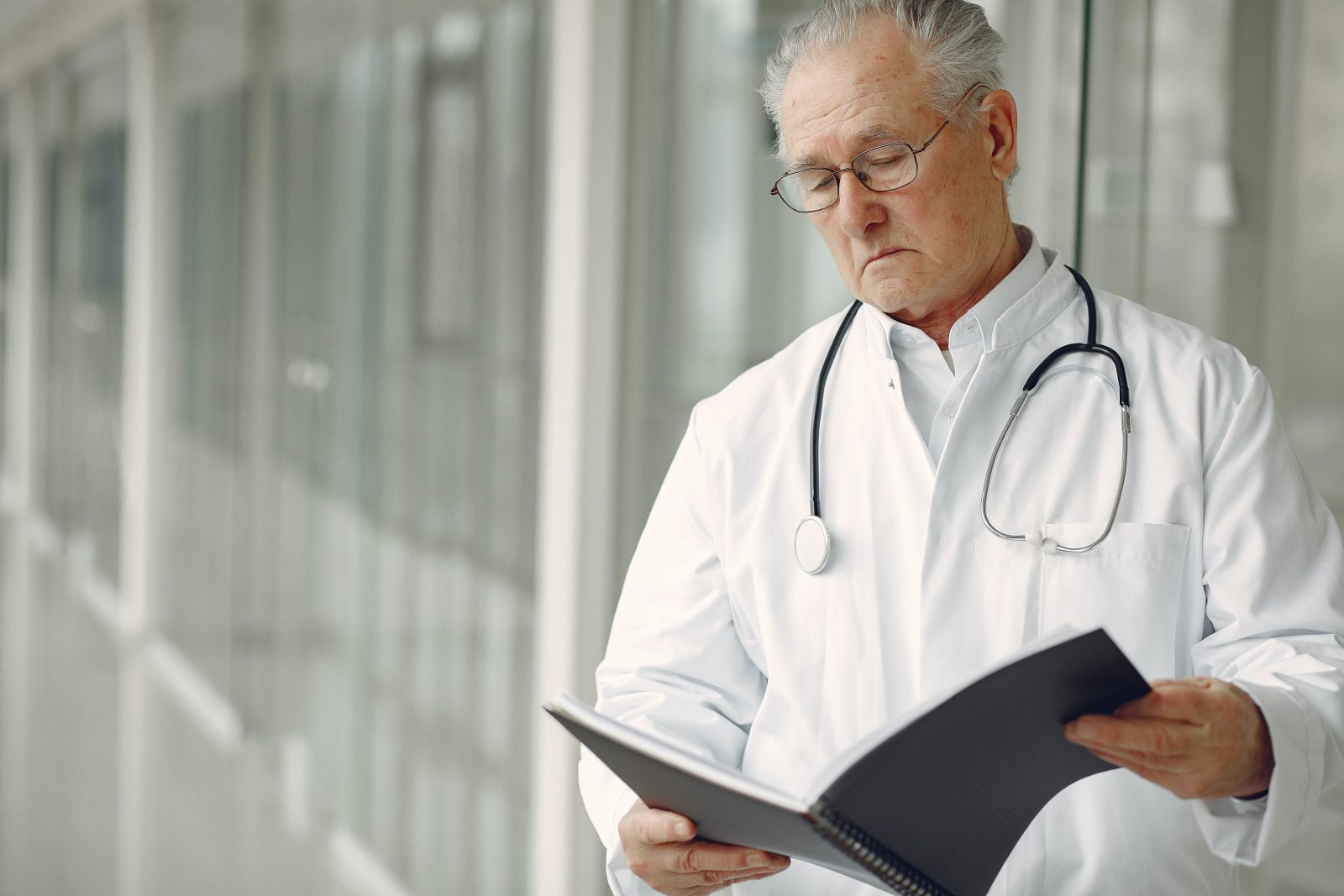 https://bettermedicarealliance.org/wp-content/uploads/2020/06/contemplative-doctor-in-uniform-reading-clinical-records-4173239-1600x1067.jpg